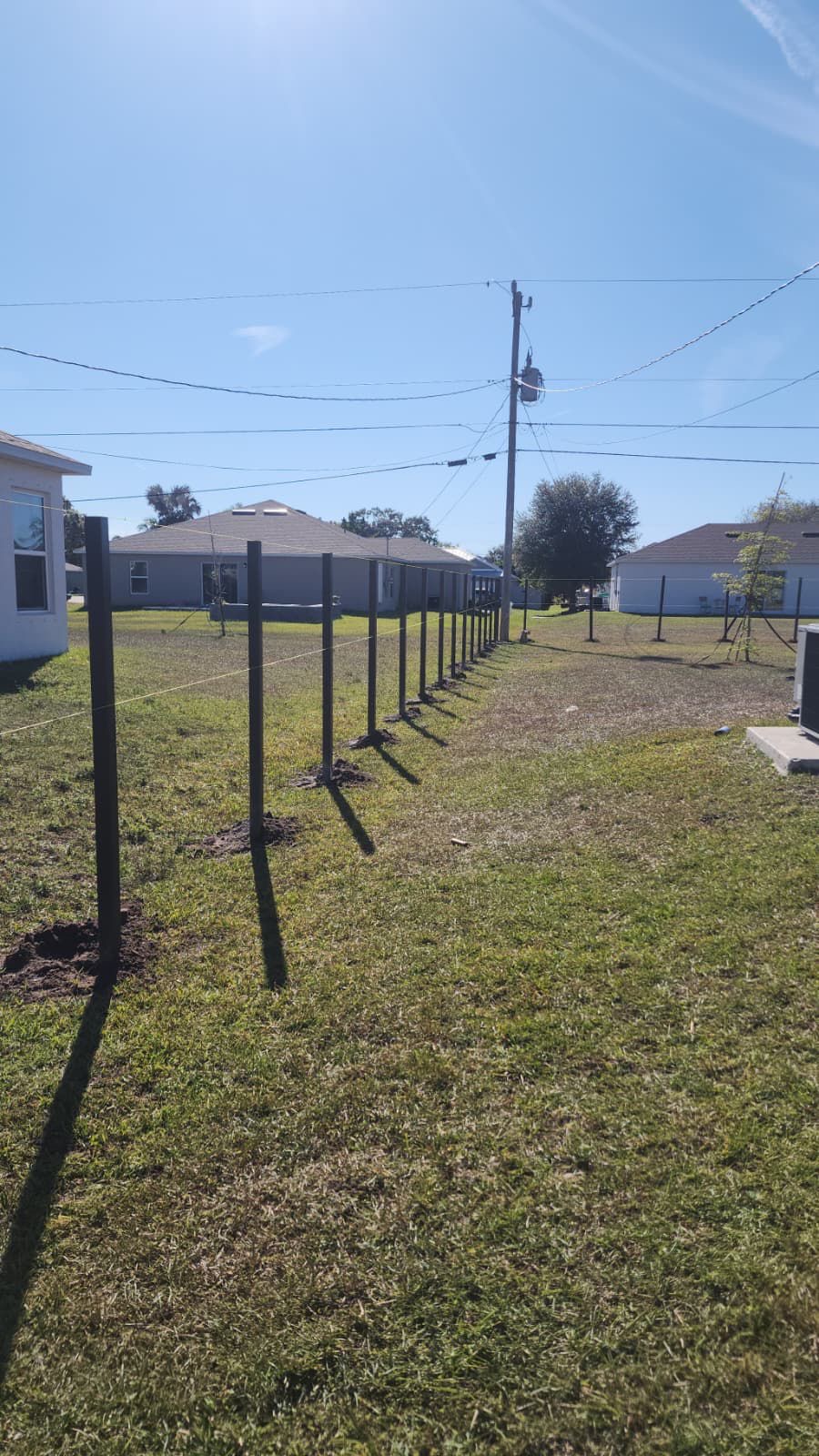 Before: fence posts installed before full panel installation